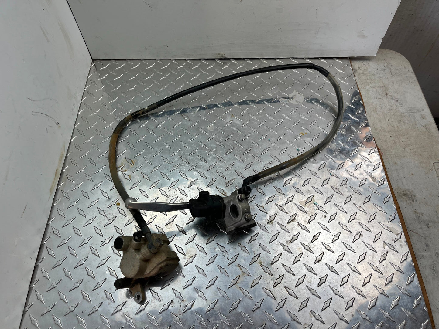 OEM HONDA CRF150R FRONT BRAKE ASSY PART# 45150-KSE-006 & 45510-GBF-J01
